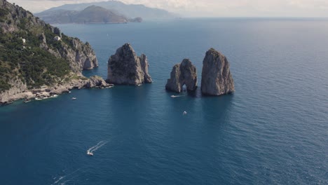 exotic tourist destination in italy, capri, faraglioni rocks, aerial view