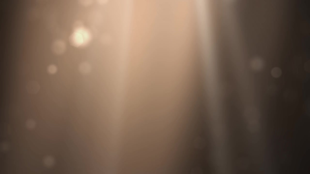 Warm Golden Light Rays and Floating Bokeh Particles Background