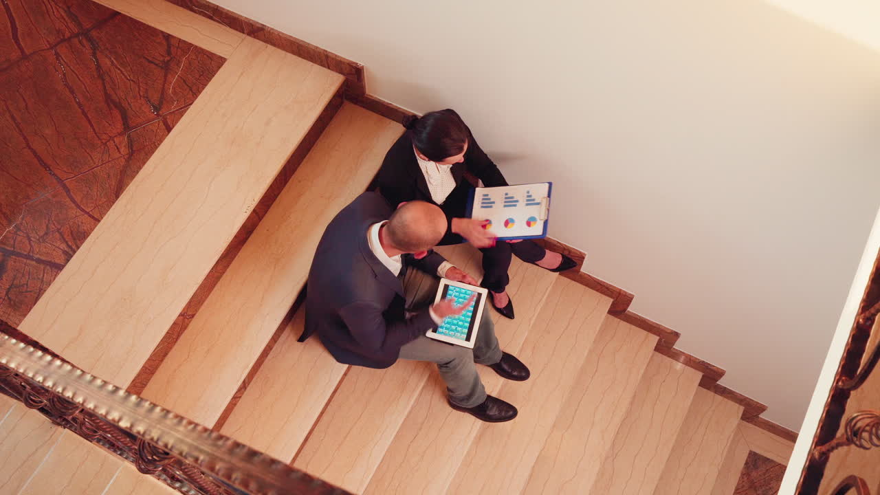 Top view of project team working on stairs