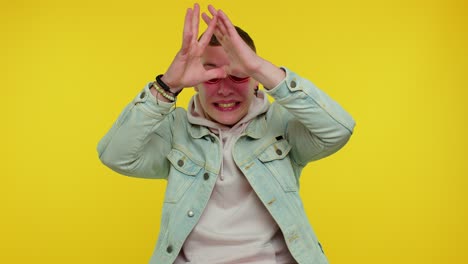 crazy man in jacket with hoodie demonstrating tongue out fooling around, making silly faces, madness