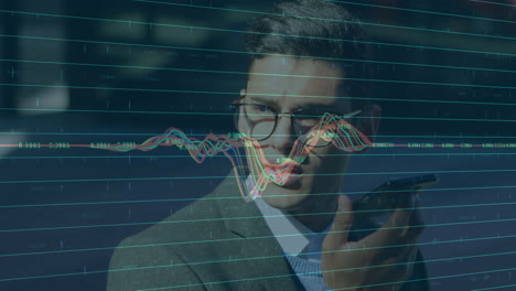 financial market data processing against businessman talking on smartphone