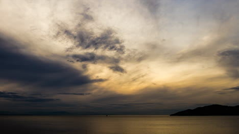 ocean and big clouds transition light to dark timelapse