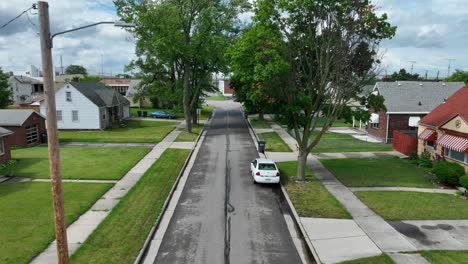 Aerial-shot-over-old-town-street-with-quaint-neighborhood-houses