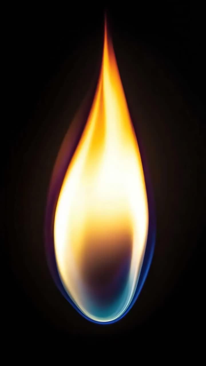 Nærbillede af en livlig flamme mod en mørk baggrund, der indfanger essensen af ild