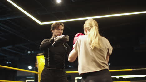 Serious-sport-couple-boxing-at-gym