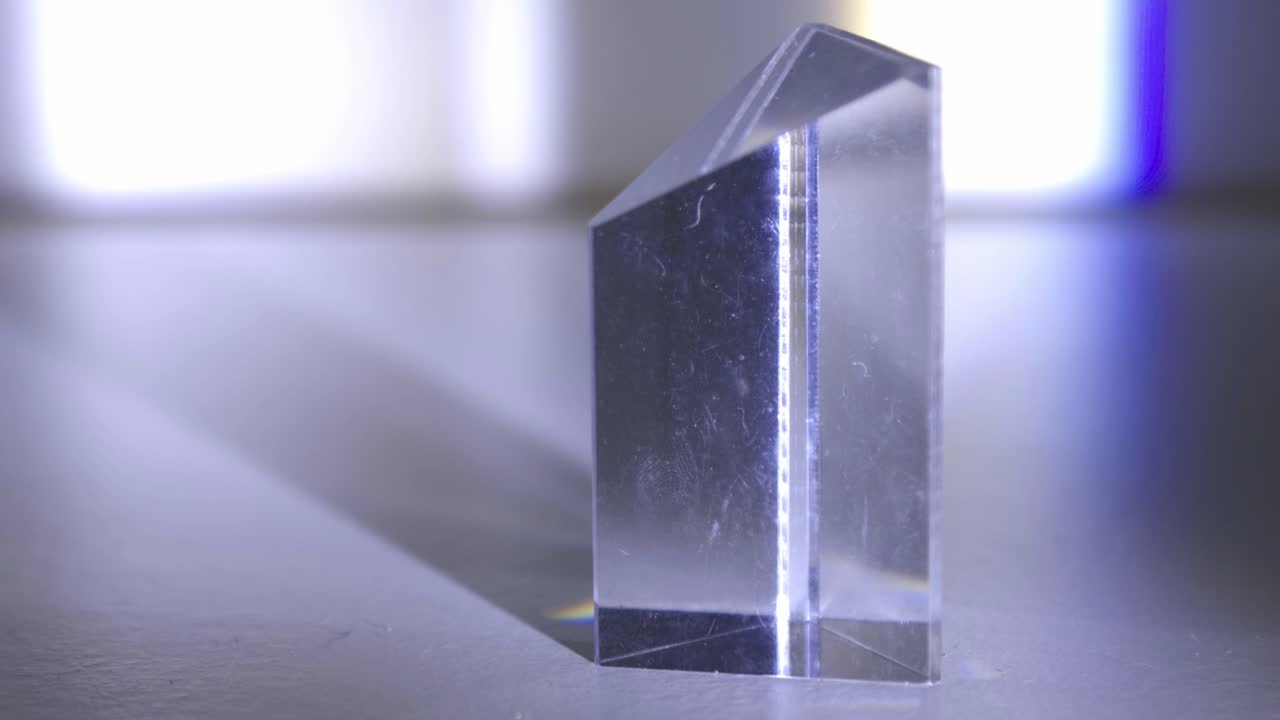 White Light Separated Into Its Component Colors Upon Passing Through A Glass Prism - close up