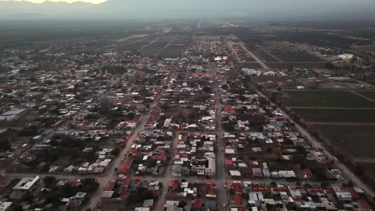 A breathtaking aerial view of sunrise over the city of Cafayate, Argentina.