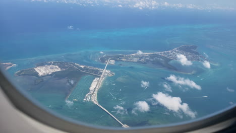 looking out plane window flying over islands