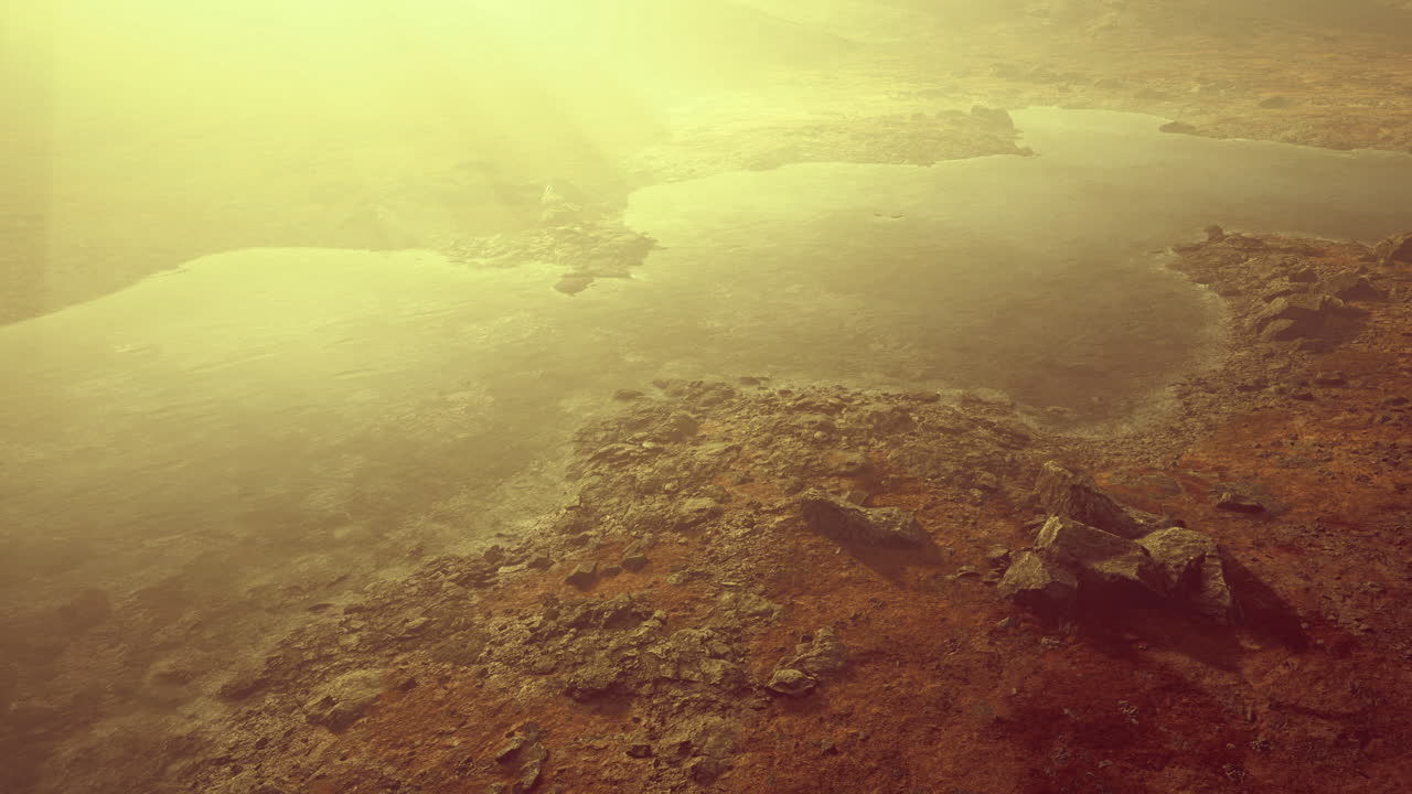 Stunning golden hour landscape over rocky terrain and tranquil waters