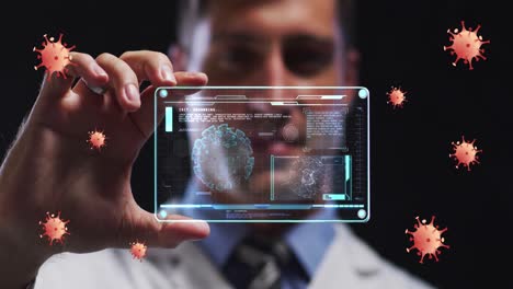 animation of coronavirus cells over male doctor holding clear tablet processing data about cell