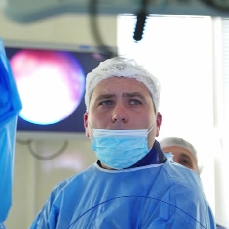 surgery on patient in hospital operating room. shot of diverse team of professional surgeons performing invasive surgery on patient