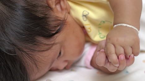 adorable baby lying on its stomach