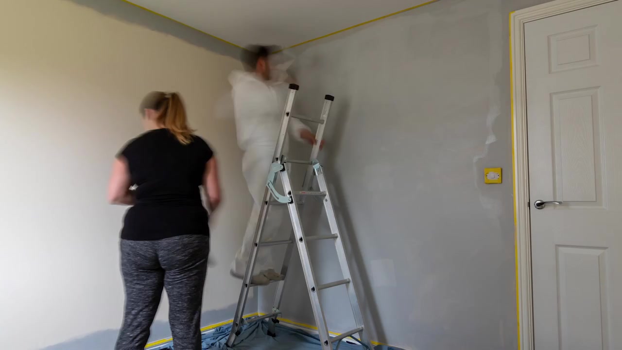Timelapse of couple painting a room together