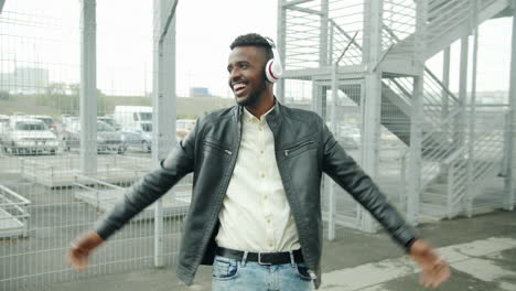 happy man dancing in the city