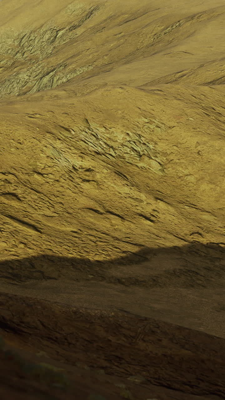 Landscape view of rugged terrain with sunlight casting shadows at dawn