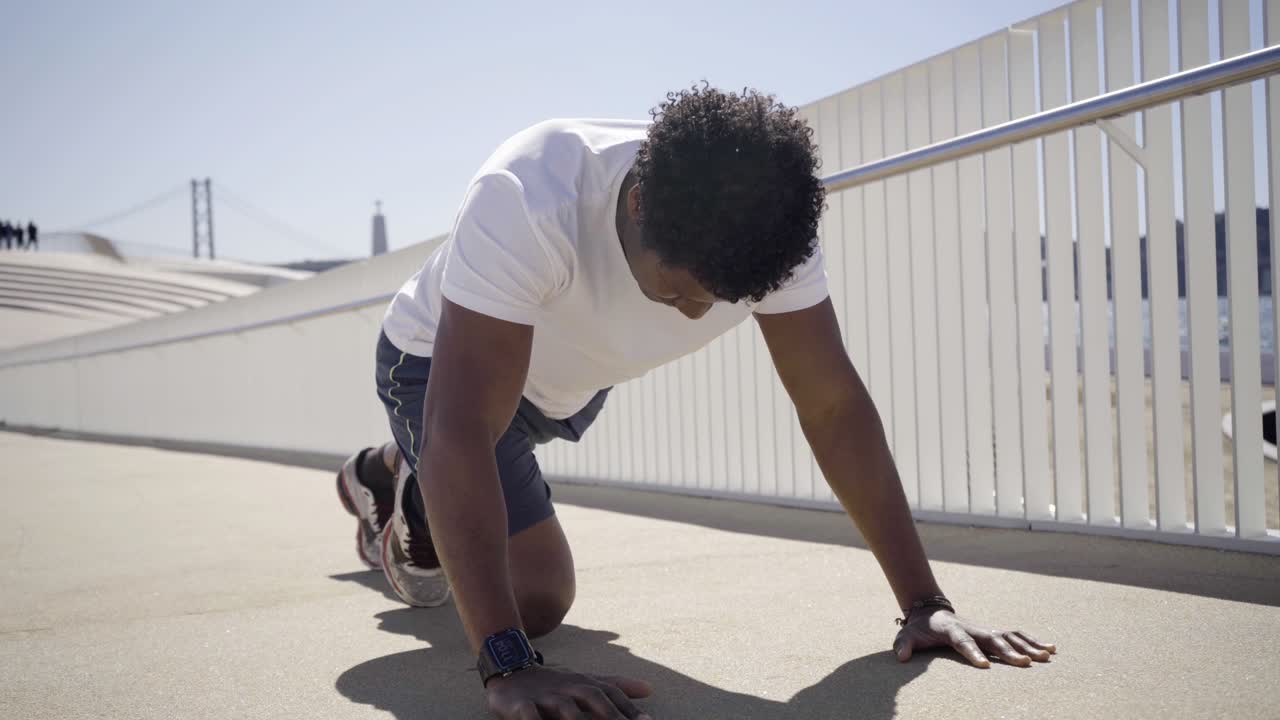 Tired African American man during morning workout.