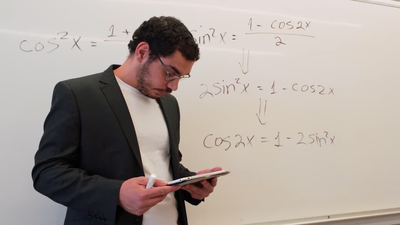 University Professor Teaching Calculus on a Whiteboard