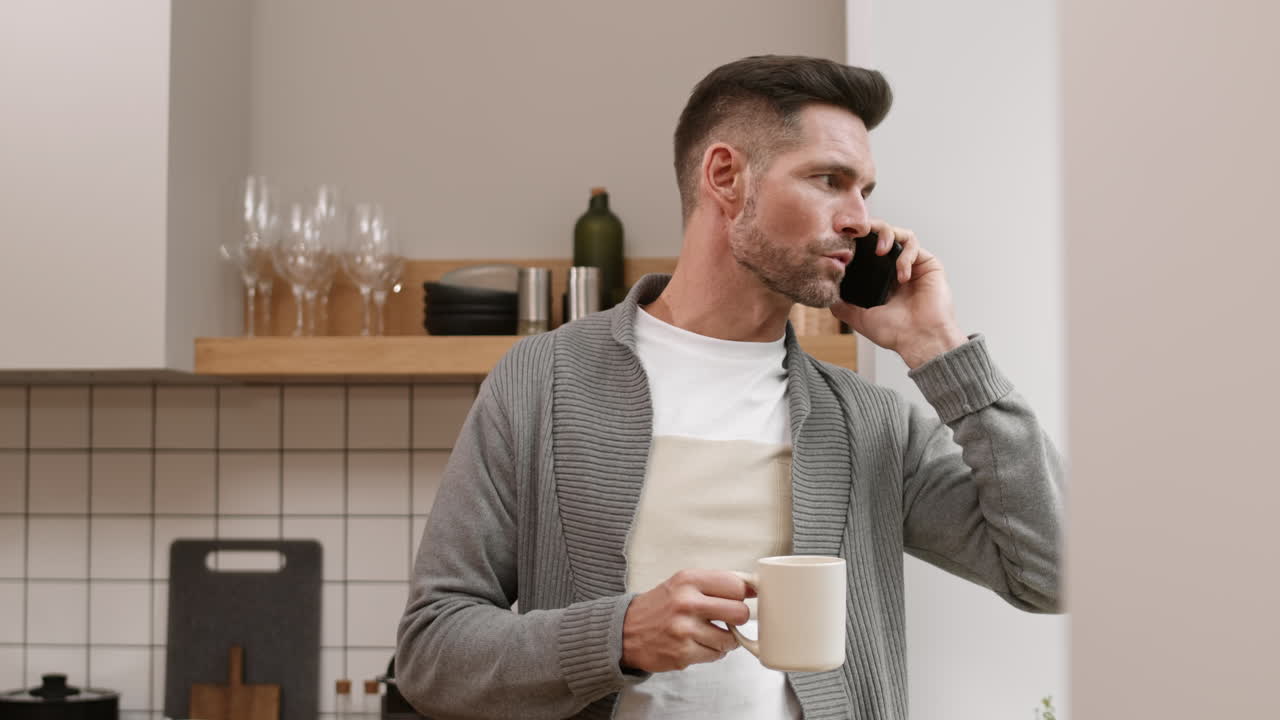 Caucasian Man Talking on Phone at Home