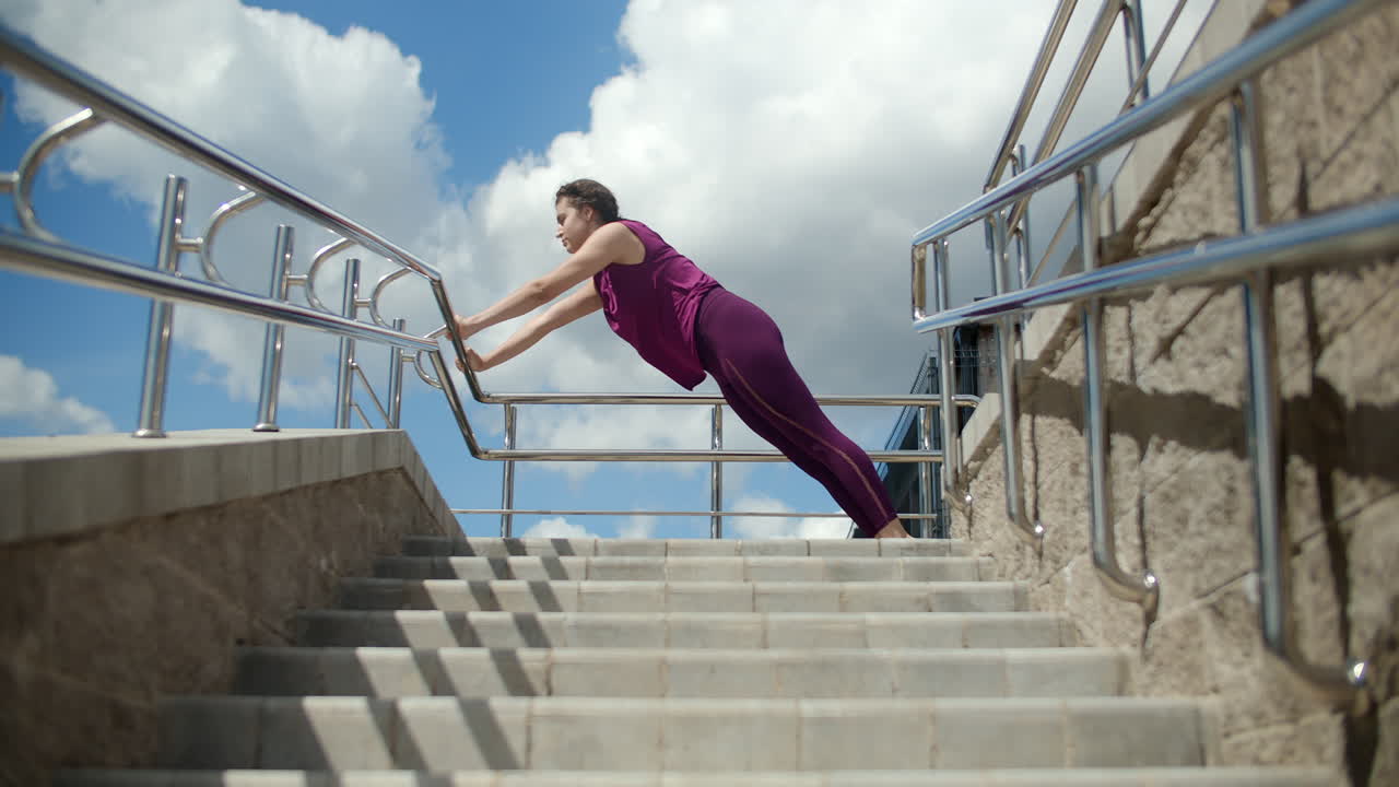 Woman Stretching Outdoors on Stairs