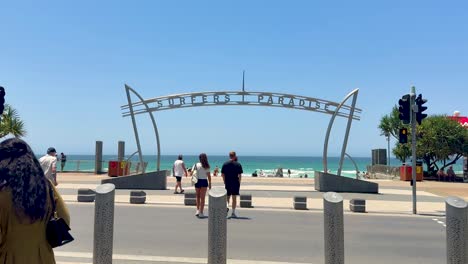 people enjoying a walk by the beach