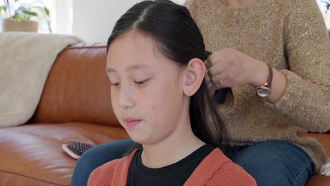 Asian-child,-home-hair-braid