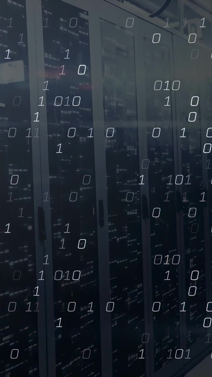 Vertical video: Data center racks pinging for monitoring, showing binary overlay growing on glass