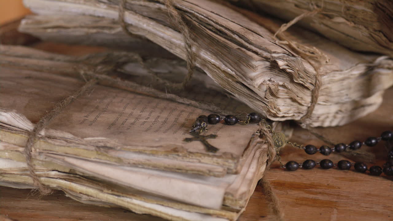 Ancient scholars study christian religious texts on weathered scrolls and documents - history and faith