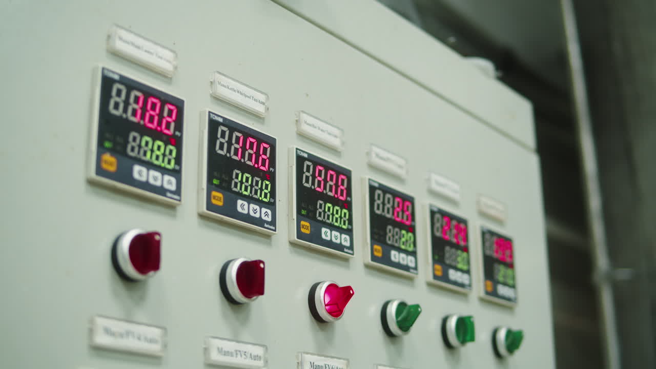 Craft beer production factory, brewery manufacture. Putting barley malt grains in conveyor close-up. Brewing, cooking alcohol in metal vats bottles