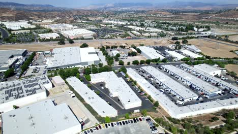 industrial area of santa clarita, california of warehouses in a sliding aerial view