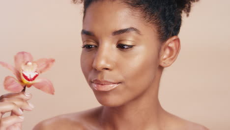 beauty, happy and face of black woman with flower