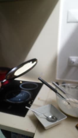 making pancakes in the kitchen