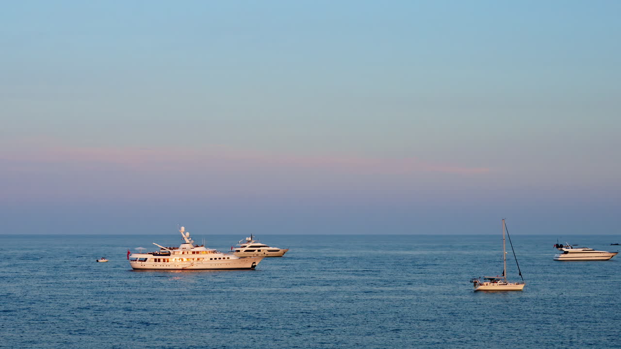 Multiple boats moving on the sea in daylight in Antibes, France
