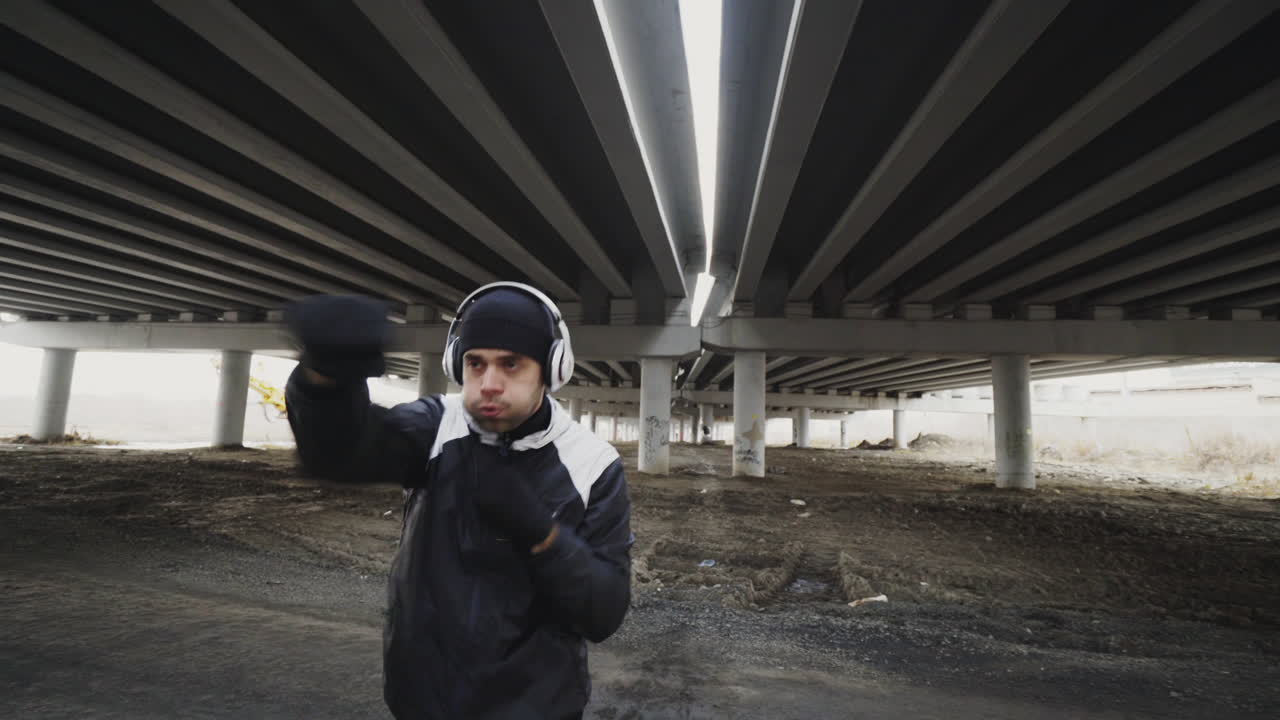 Man Boxing Workout Under an Overpass
