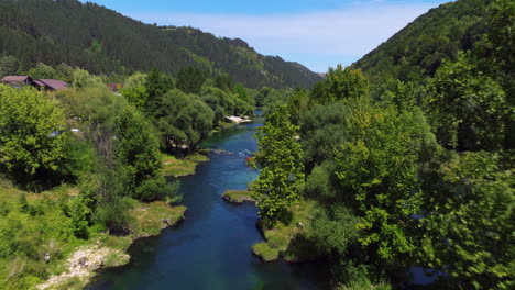 people rafting on una river surround by lush trees nearby cazin town in bosnia and herzegovina