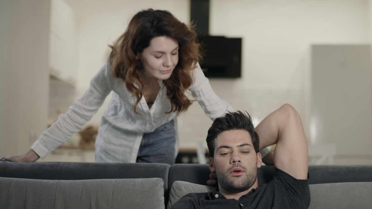 Serious man switching tv channels