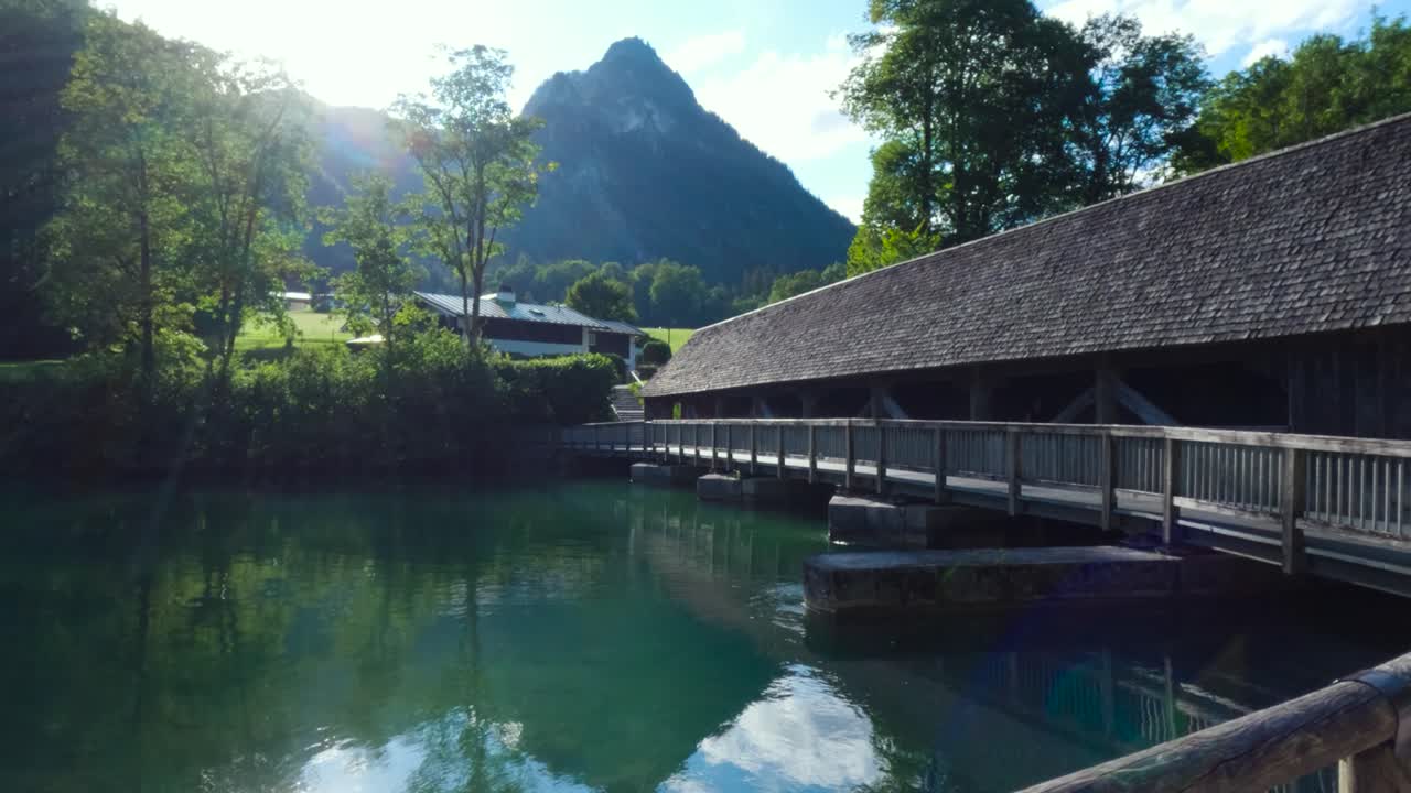 Wooden bridge with roof in the King's Lake, K&ouml;nigssee in Germany, Bavaria