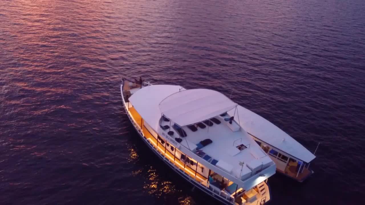 Luxury Yacht at Sunset in the Maldives