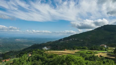 Clouds-moving-fast-over-Caramulo-mount-and-valley-in-background,-Portugal