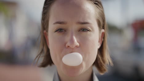 portrait-of-attractive-young-woman-blowing-bubblegum-smiling-playful-enjoying-happy-summer-vacation-lifestyle