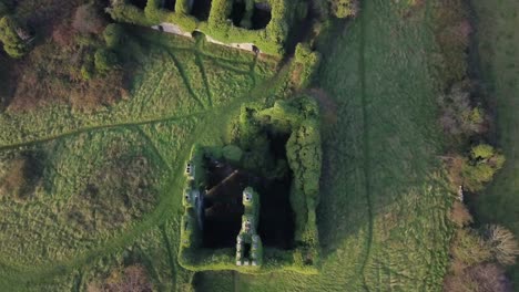 Bird's-Eye-View-Ascending-to-Old-Irish-Castle,-Galway