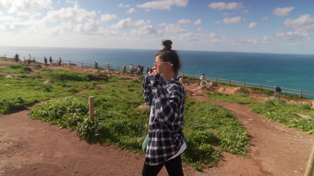 Woman on a scenic coastal path