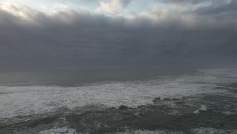 storm waves crashing sea beach in blue weather nature background aerial view