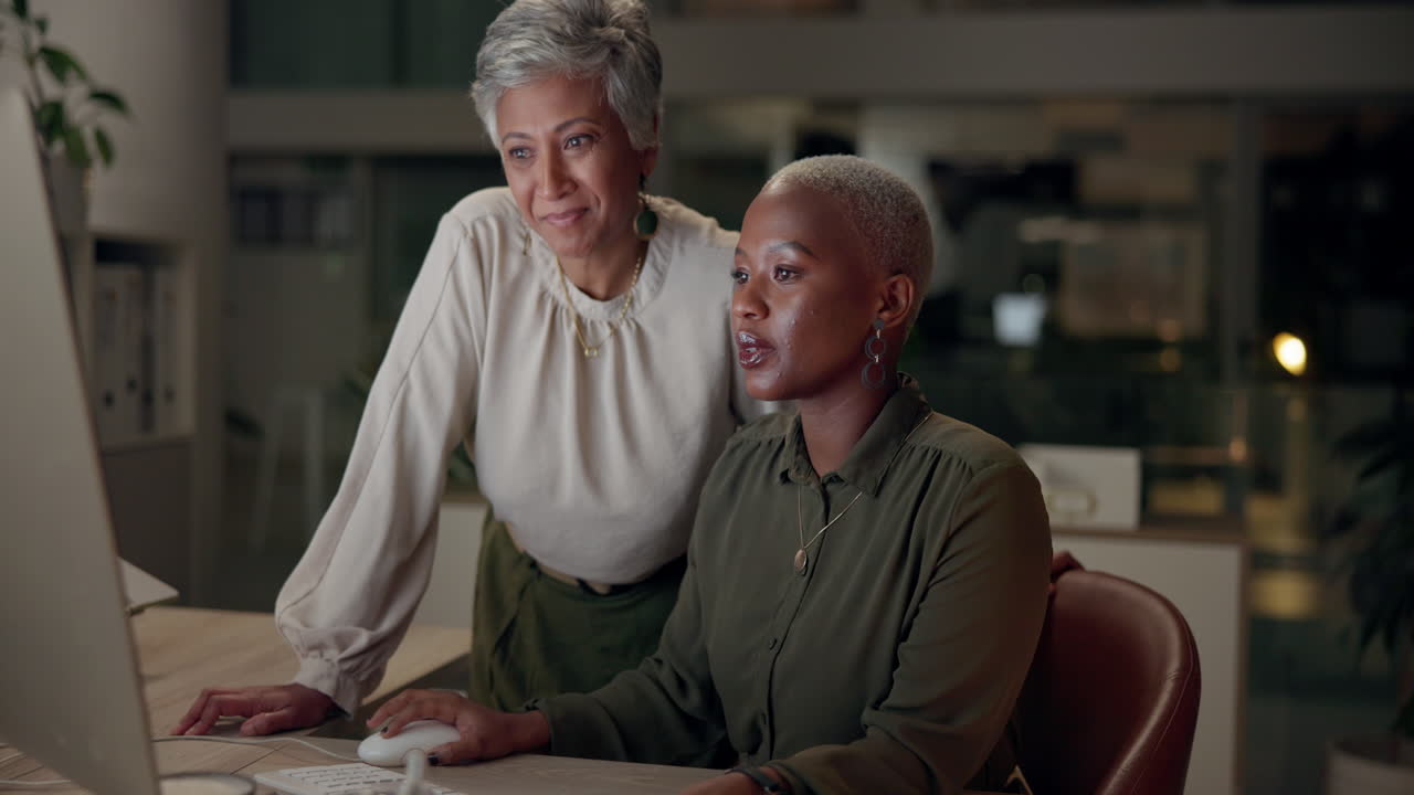 Two women working together in an office
