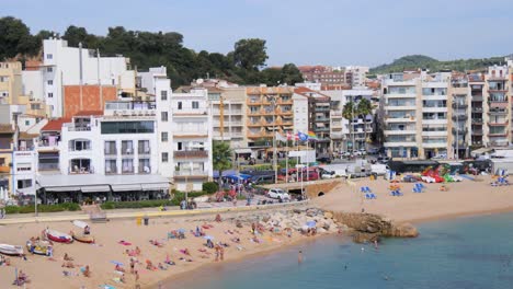 timelapse on the costa brava of girona blanes barcelona beach with people fast camera fixed shot turquoise blue sea