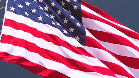 static slow motion shot, close up, of american flag, the stars and stripes, waving in the wind, in united states of america