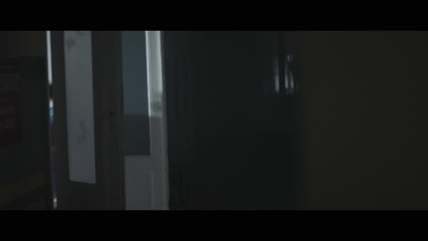 a girl runs through strange corridors of abandoned hospital