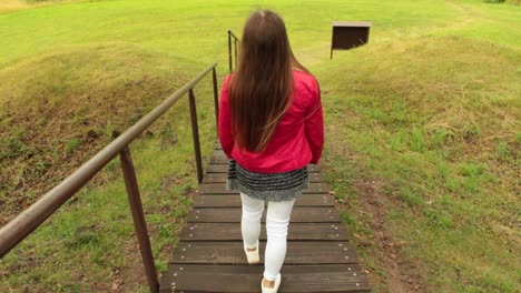 girl walking down the stairs outside