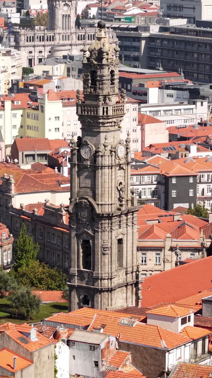 Porto, Portugal. Vertical Drone Shot of Clerigos Church Tower and Old Town Buildings