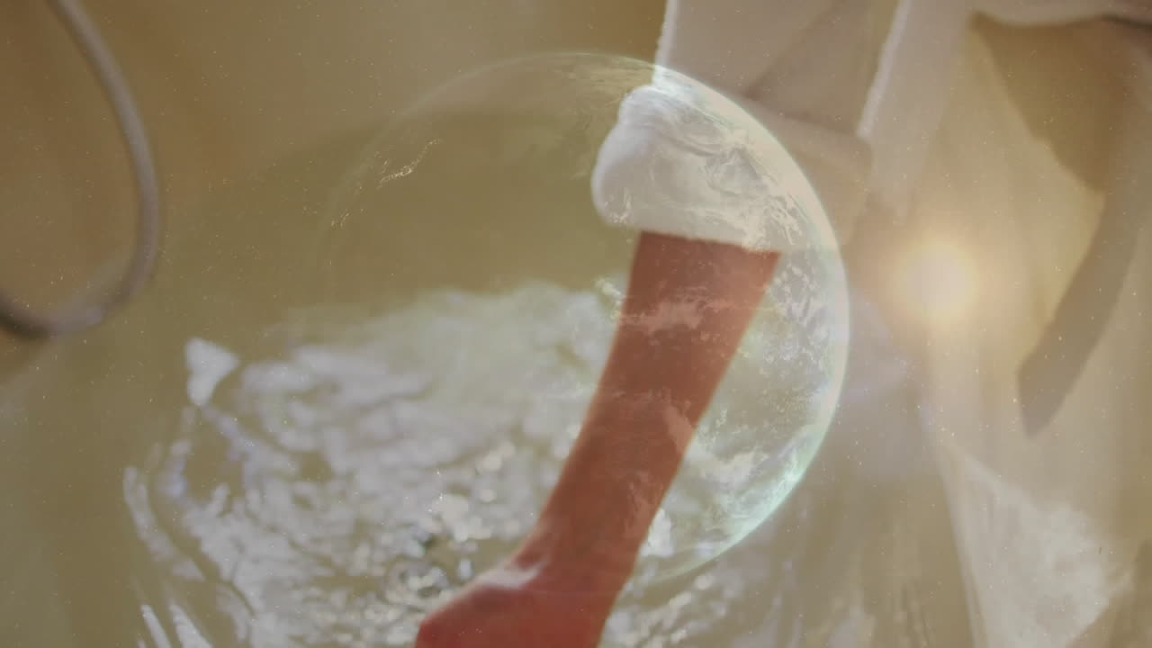 woman soaking hand in soapy water under faucet in beauty industry, showing animated bubble icons