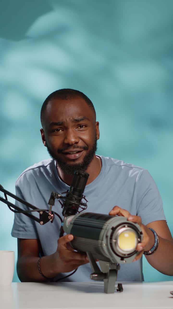 Man recording podcast with microphone and light